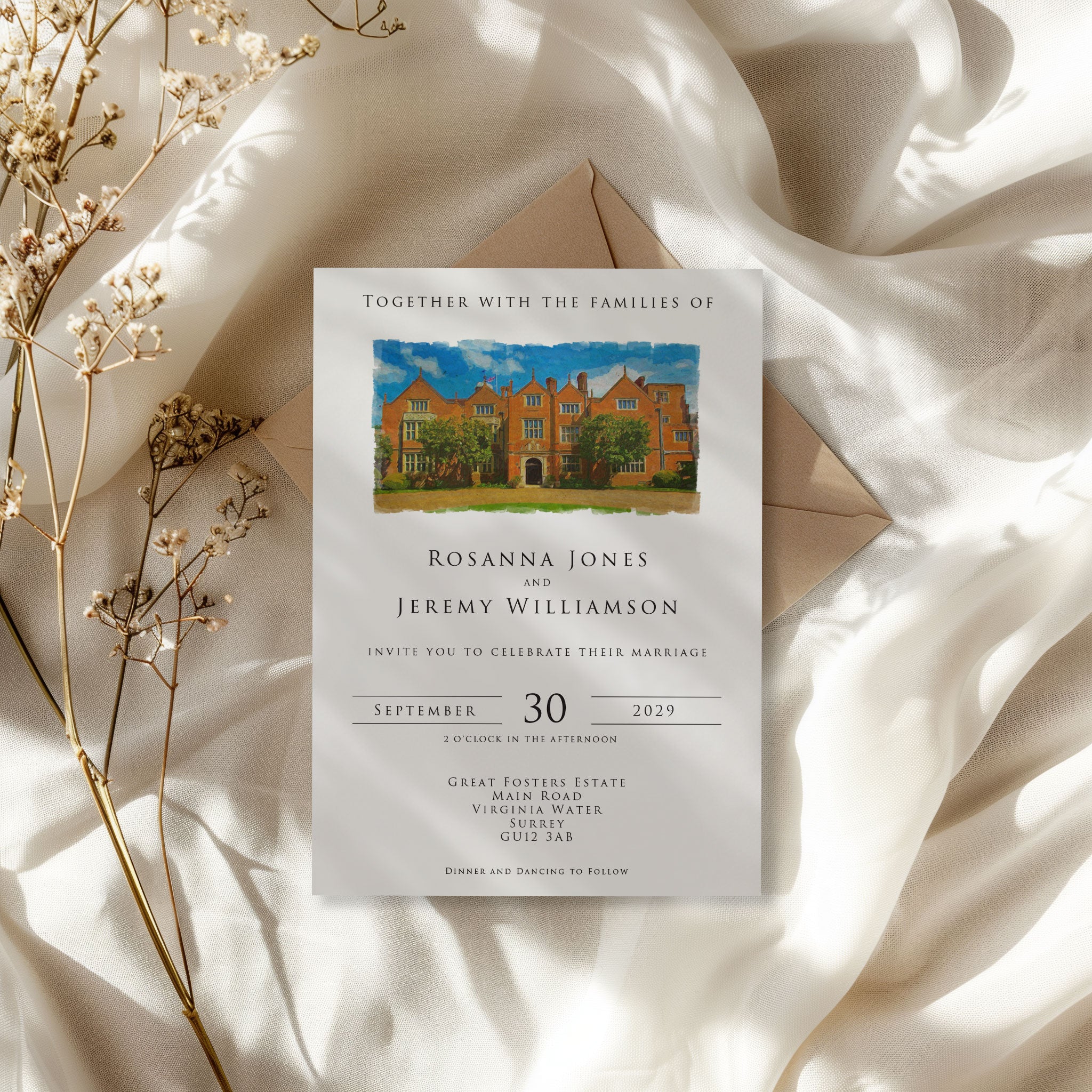 Wedding invitation card with venue illustration on a soft fabric background