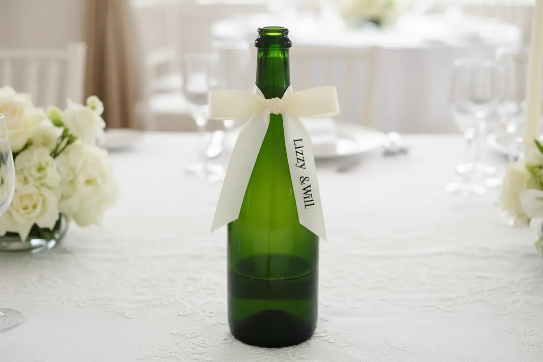 Green bottle with cream wedding bow